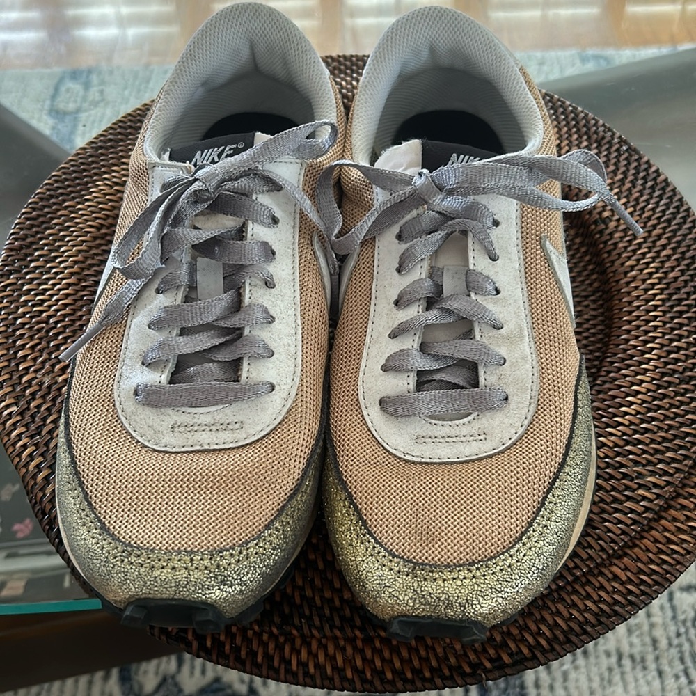 Nike sneakers muted gold color, gold, tan and white in color , laces grey